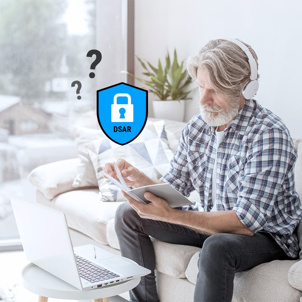 Man sitting on a couch, learning