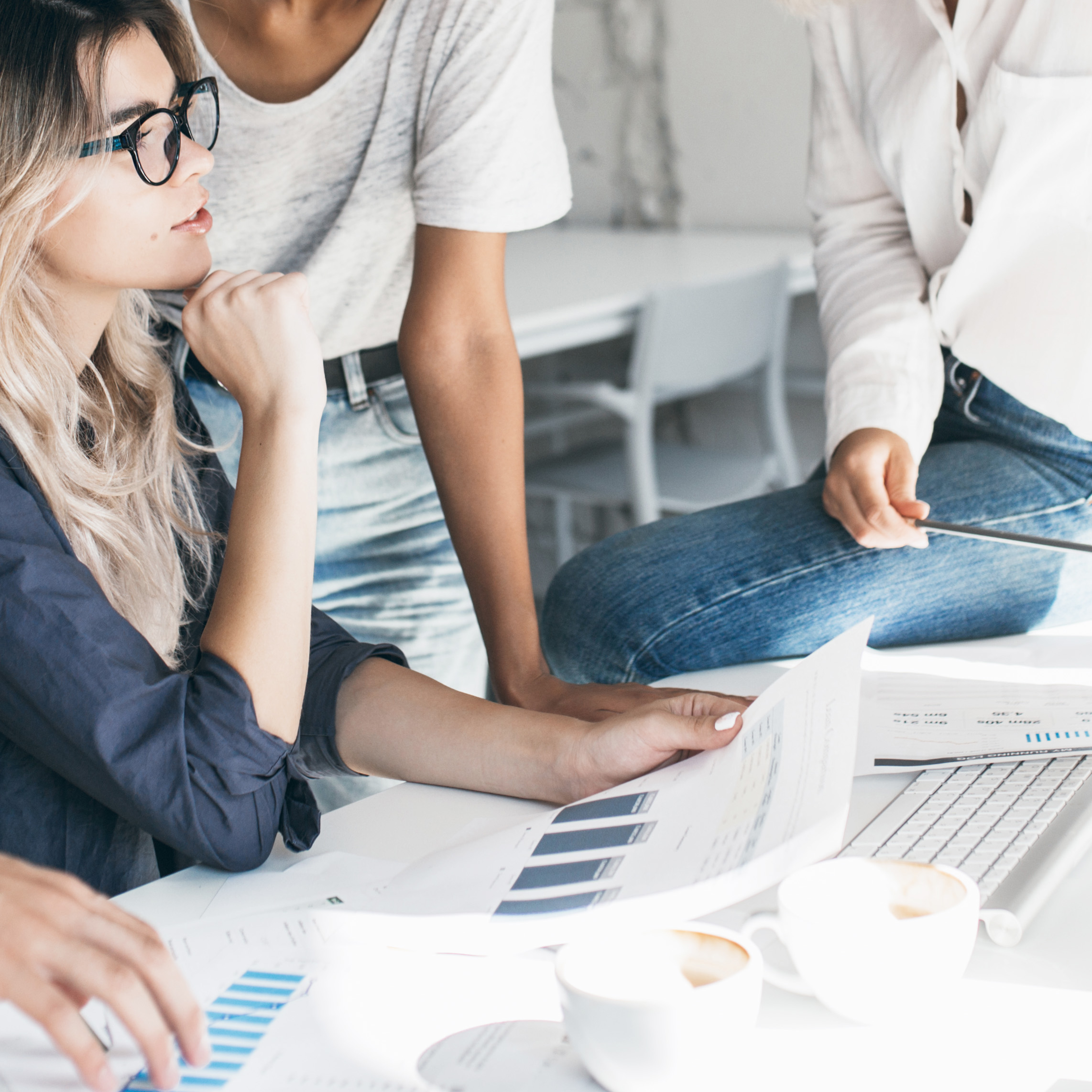 Women discussing business achievements