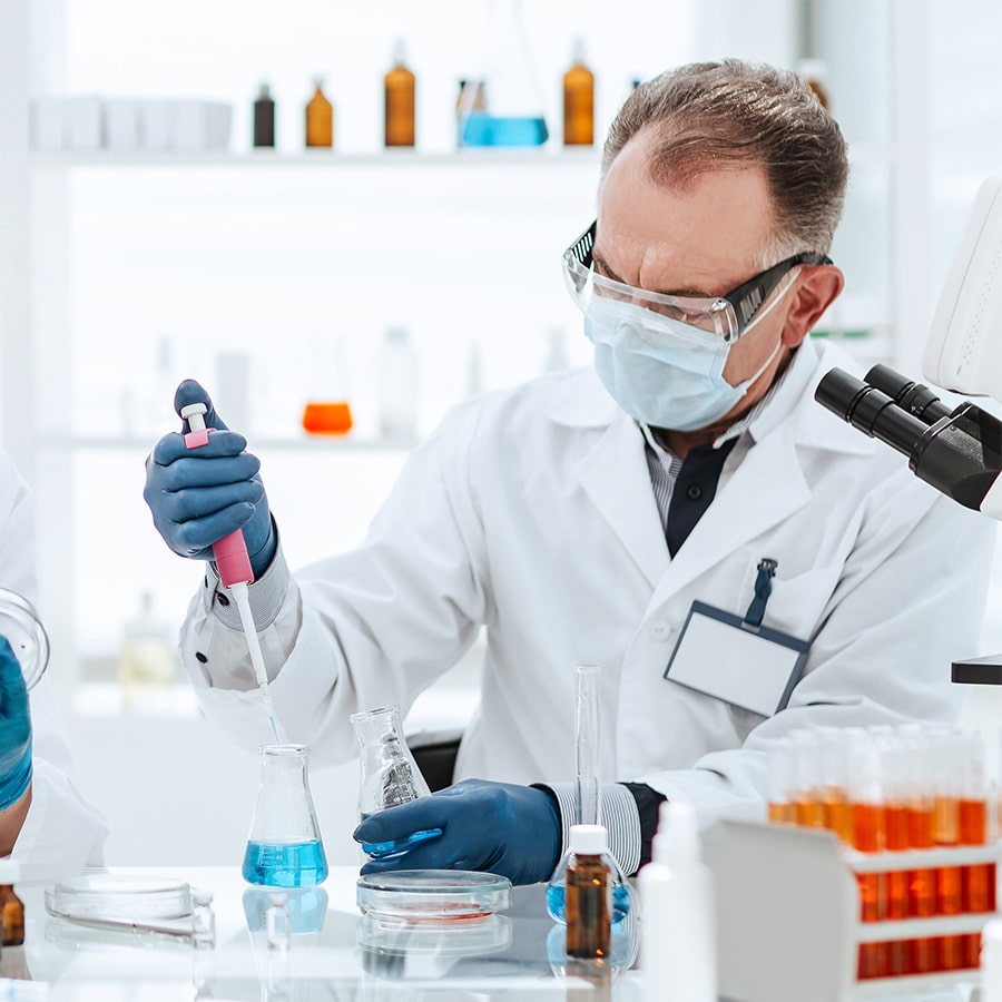 Scientist manipulating chemicals in a lab